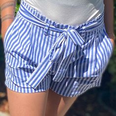 Blue Striped Shorts With Front Tie High Waist Material: 60% Cotton , 40% Polyester Chic Striped Bottoms For Beach Season, Blue Bottoms With Tie Waist For Beach Season, Blue Tie Waist Bottoms For Beach Season, Blue Shorts With Tie Waist For Spring, Blue Tie Waist Shorts For Spring, Striped Summer Bottoms For Day Out, Blue Cotton Bottoms With Tie Waist, Blue Cotton Tie Waist Bottoms, Blue Bottoms For Summer Day Out