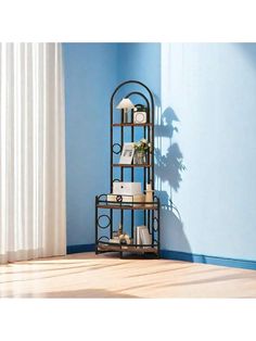 a corner shelf with books and magazines on it in a blue room next to a window