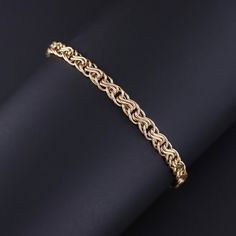 This vintage Italian bracelet (circa 1980-1990) features woven links of 14k gold. The bracelet measures 7 inches by 0.25 inches wide, and it is in great condition.  It weighs 3.84 grams.  We have many other fantastic offerings of period fine and costume jewelry posted on our Etsy store, so please consider browsing our other items. We send all items in individually packaged gift boxes and offer layaway plans! + Trademark Antiques Shop Homepage https://www.etsy.com/shop/TrademarkAntiques + Our Store Policies https://www.etsy.com/shop/TrademarkAntiques/policy?ref=shopinfo_policies_leftnav + Connect with us on Social Media (Get access to monthly giveaways, special sales, and sneak peeks at our new items before they're listed on our store) FACEBOOK- https://www.facebook.com/trademarkantiques IN Classic Gold Braided Bracelet For Formal Occasions, Formal Gold Braided Jubilee Bracelet, Formal Gold Braided Jubilee Style Bracelet, Elegant Gold Braided Bracelet For Formal Occasions, Formal Gold Bracelet With Wheat Chain, Formal Yellow Gold Bracelet With Wheat Chain, Elegant Wheat Chain Bracelet For Formal Occasions, Formal Yellow Gold Wheat Chain Bracelet, Classic Gold Bracelet With Wheat Chain