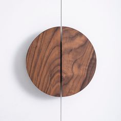 a round wooden object hanging on the wall