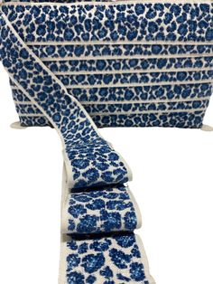 four pieces of blue and white patterned fabric