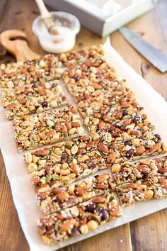 a wooden table topped with lots of granola bars