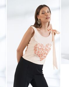 ▶ ABOUT THE TOP: This ivory crepe top is a statement of style. Hand embroidered with sequin in shape of small hearts and a big statement organza bow. Perfect for a day out at the office or a casual brunch with your friends. Made from 100% pure crepe fabric, the top has a regular fit and we offer it in plus sizes up to 5XL. ▶ ITEM DETAILS: * Top made with pure crepe * The model is 5'7 tall and wearing size M. * Handmade item, crafted to perfection. * The length of the top is 19 inches ▶ FABRIC: * Fitted Feminine Embroidered Top, Elegant Embroidered Summer Top For Party, Elegant Embroidered Summer Party Top, Fitted Feminine Top With Floral Embroidery, Spring Party Tops With Pearl Embroidery, Summer Party Tops With Floral Embroidery, Spring Evening Top With Pearl Embroidery, Chic Evening Tops With Pearl Embroidery, Pearl Embroidered Evening Top For Spring