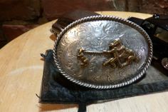 "This is a very beautiful vintage Fleming Sterling Silver Western Belt buckle. On the back it is stamped \"Fleming Silver\" What a wonderful gift this roping belt buckle would make. It is in great vintage shape and any roper would love this. It has that all western rodeo look to it. Measures 3 1/2\" by 2 1/2\" Buckle weights 68.7 grams I use the address that you provide Etsy for shipping, if you have the wrong address, you will need to repay the shipping. Please note that I do the exact shipping Western Concho Belt Buckles For Country Events, Adjustable Concho Belt Buckles For Western-themed Events, Southwestern Antique Belt Buckle For Rodeo, Western Antique Belt Buckle For Rodeo, Southwestern Antique Belt Buckles For Ranch, Vintage Engraved Belt Buckles For Rodeo, Vintage Silver Belt Buckles For Western-themed Events, Engraved Adjustable Western Belt Buckles, Rustic Concho Belt Buckles For Rodeo