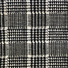 a black and white checkered pattern on fabric