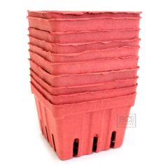 a stack of pink pots sitting on top of each other in front of a white background