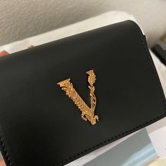 New. Comes With Boxes, Dust Bag, Cards Proof Of Purchase If You Want To See Luxury Rectangular Wallet On Chain As Gift, Luxury Black Rectangular Wallet On Chain, Designer Black Rectangular Wallet On Chain, Luxury Wallets With Gold-tone Hardware As Gift, Luxury Black Wallet On Chain For Party, Versace Wallet, Versace Bag, Versace Bags, Black Clutch