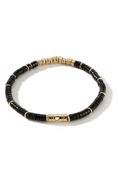 Signature carved 14-karat gold and rich onyx beads alternate on this handcrafted bracelet secured by an intricate push clasp. Onyx/14k gold Imported Classic Gold Jewelry With Black Beads, Hand-strung Onyx Jewelry In Gold, Elegant Yellow Gold Bracelets With Black Beads, Elegant Yellow Gold Bracelet With Black Beads, John Hardy Jewelry, Latest Bracelets, Black Onyx Bracelet, Double Wrap Bracelet, Silver Bead Bracelet