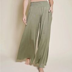 Maxi Palazzo Bamboo Trousers By Fabacollection.Com Colors Available- Blue, Olive, Tan. See The Other Listing For Blue Abd Tan. Brand New! Pants Have Deep Pockets! Grab Those Bamboo Palazzo Pants While They Are In Stock! Those Pants Are Ankle Length On A Woman Standing Tall At 5 Ft 6'. Match Your New Bamboo Palazzo With One Of Ane's Colorful Tops, Wrapped Belts, Or Shawls. Belt It! Neutral Does Not Have To Be Plain. Crazy Wide Open Palazzo With Pockets, Smocks Elastic Waist With Comforts& Flexibi