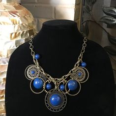 Bold And Blue! Statement Necklace With Stunning Blue/Indigo Detailing On A Single Chain Design. Comes With Matching Earrings (Picture To Come Soon). Still In Original Packaging. Necklace Worn Once, Earrings Never Worn. Blue Beaded Brass Necklaces, Beaded Metal Round Pendant Jewelry, Adjustable Blue Costume Jewelry Necklace, Costume Jewelry For Accessorizing, Blue Brass Jewelry With Adjustable Chain, Blue Dangle Jewelry With Adjustable Chain, Blue Brass Round Jewelry, Blue Round Brass Jewelry, Handmade Blue Metal Necklace