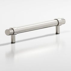 a stainless steel handle on a white surface