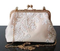 The Ivoiry lace Bridal Clutch and Wedding clutch bag are a unique piece of the Olga's Luxury Creation. They will sublimate you during your galas, parties and events. Elegance, style and originality are the key parts of these creations. The use of quality materials, advanced know-how are essential values to offer you the best creations. What are you waiting for to sublimate yourself and being original, come to discover our large collection of evening bags. Wedding clutch bag for Women. Ivoiry Cha Wedding Clutch Bag, Purse For Wedding, Silk Clutch, Bridal Handbags, Bridal Purse, Clutch Bag Wedding, Purse White, Wedding Day Gifts, Elegance Style