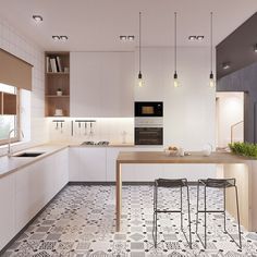 a modern kitchen with white cabinets and an island