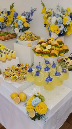 a table topped with lots of different types of desserts and drinks on top of it