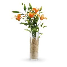 a vase filled with orange flowers on top of a table