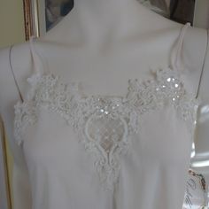 Perfect For A New Bride! Never Been Worn And Still Has Tag, Cream, 100% Polyester Dentelle Vintage Nightie. Deep V In Back With Sweet Bow! 2 Tiny Thread Pulls In Back Will Not Affect Wear Of Garment (See Last Photo). Lace Cami Sleepwear With Delicate Straps, Lace Bedtime Camisole, Lace Camisole Top For Bedtime, Spring Wedding Night Lace Camisole, Delicate Lace Camisole Sleepwear For Parties, Lace Cami Sleepwear For Wedding Night, Delicate Lace Camisole For Sleep, Feminine Lace Stretch Sleepwear, Lace Camisole Top For Wedding Night