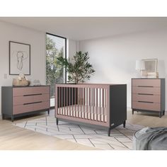 a baby's room with two dressers, a crib and a potted plant