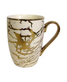 a white and gold coffee cup on a white background with brown lines in the middle