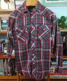 Vintage 90s WRANGLER Westernern Snap Button Plaid Shirt100% CottonMade in BangladeshSize LARGEMeasuraments:Length 33"Width 23"Sleeve Length 25"Shoulders 20"Collar 15.5"The shirt is in great pre-worn vintage condition. Minimal to no wear present. No rips, tears or stains. Incredible quality throughout.Please check out my other listings for more vintage and nostalgia items! Vintage Plaid Tops With Snap Buttons, Vintage Button-up Flannel Shirt With Snap Buttons, Vintage Plaid Shirt With Snap Buttons, Vintage Snap Button Flannel Shirt, 90s Style Long Sleeve Shirt With Button Closure, Vintage Multicolor Shirt With Buttons, Vintage Long Sleeve Flannel Shirt With Buttons, Vintage Plaid Tops With Button Closure, Yellow Maxi Dress