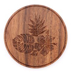 a wooden plate with an image of flowers and leaves on it