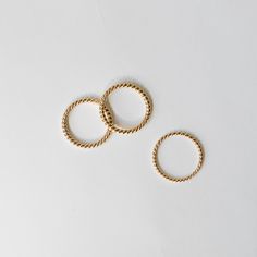 This is our By Brockton house twist ring in solid 14k yellow gold. The wire is handmade and hand twisted to order in a small Toronto workshop. We love it because it is so versatile. It looks great on its own and pairs nicely with an engagement ring or classic ring stack. Available in 1.5 mm and 2.0 mm widths. MATERIALS 14k yellow gold. SIZE The ring will be custom made in your size. Size 6 ring is in-stock and available and ready to ship immediately. Additional fee may apply for larger sizes. Please let us know your size when ordering. MAKE TIME It takes approximately 3 weeks to custom make your ring. Handmade 14k Yellow Gold Stackable Rings, Minimalist Twisted Gold Rings, Adjustable Spiral Yellow Gold Ring, Gold Spiral Stackable Rings, Modern Twist Stackable 14k Gold Midi Rings, Minimalist Twisted Rings For Everyday Wear, Spiral 14k Gold Ring, Minimalist Twisted Rings For Everyday, Minimalist 14k Gold Wire Wrapped Rings