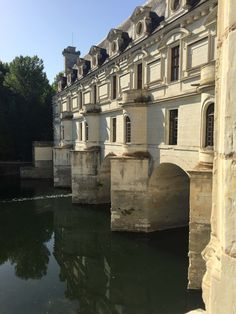 an old bridge over a body of water