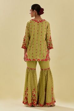 Green short kurta featuring floral silk applique motifs and sequin embellishments. Comes with embellished farsi pant, scalloped hem dupatta and inner slip. - Aza Fashions Fitted Embellished Bottoms For Festive Season, Fitted Embellished Bottoms For Festive Occasions, Festive Fitted Embellished Bottoms, Spring Fitted Sharara With Gota Work, Fitted Spring Sharara With Gota Work, Resham Embroidered Bottoms For Wedding And Festivals, Fitted Pants With Zari Work For Festivals, Traditional Bottoms With Dupatta For Wedding And Festivals, Festival Fitted Pants With Zari Work