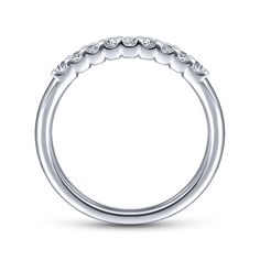 an 18k white gold wedding band with round diamonds