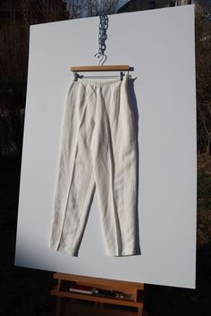 Vintage 1990's Rafaella White Linen Tapered Pant Brand: Rafaella Material: 55% Linen, 45% Rayon Color: White Measurements 26"Waist/36"Hip/37.5"Length/10"Inseam Original Tag Size: 8 Condition: Very Good Damages: Several small, light discolorations  Please refer to Great Good's FAQ's for more information on measurements, sizing, condition grades, policies, repair/mending services and more! Tapered Pants, White Linen, Trousers Women, Festival Season, Capri Pants, Pants For Women, Art Collection, Bathing Beauties, White