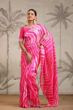 Go for this beautiful pink leheriya embroidered tussar silk saree at parties and festive occasions. The saree comes with pink embroidered designer saree blouse. Shop designer saree online in USA from Pure Elegance. Disclaimer: The actual product may vary slightly from the image. These are custom orders, hence expect slight variation in color, placement of the motif or buta. ESTIMATED DELIVERYBecause this is a custom order, it would take about 4 weeks from the date of purchase. RETURN POLICYThis product is a custom order and cannot be returned or exchanged. Pink Designer Blouse, Pink Leheriya Saree, Pink Unstitched Saree With Printed Motifs, Semi-stitched Pink Embroidered Saree, Semi-stitched Pink Floral Saree, Semi-stitched Pink Floral Print Saree, Suits Indian, Designer Saree Blouse, Sharara Suits