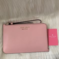 Kate Spade Cameron Medium Saffiano Leather Wristlet *New With Tags *Light Pink Saffiano Leather Exterior *Light Pink Nylon Interior *Interior: (4) Card Slots *Exterior: (1) Zip Slot *L-Zip Closure, Gold-Tone Hardware *Light Pink Saffiano Leather Wrist Strap *Approximate Dimensions: 8" X 5" Pink Pouch Clutch With Wrist Strap, Pink Clutch With Wrist Strap, Trendy Pink Clutch With Zipper Closure, Trendy Pink Clutch With Zipper, Pink Feminine Clutch, Pink Wristlet For Everyday Use In Spring, Chic Pink Clutch With Zipper Closure, Chic Pink Bag With Wrist Strap, Trendy Pink Wristlet For Spring