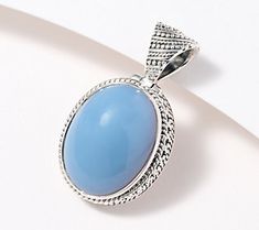 It's easy to make your next signature look a masterpiece when you wear this artisan crafted pendant. The oval blue-opal design adds a cool splash of color to your daily ensemble. Signature Look, Oval Pendant, Artisan Craft, Blue Opal, Pendant Jewelry, Color Splash, Opal, Make Your, Make It Yourself