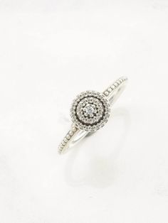 This ring is a size 6 (USA); It may not be resized Markings: S 925, Ale (Pandora), 52 (Tested & guaranteed to be Sterling Silver) This ring weighs 1.7 Grams The Stone/Design is White CZ, Diamond      The Stone/Design measures Varies The condition of this ring is Estate, Excellent, no stone wear This vintage item is circa Pre 2004  Stock# R3490Aly For more vintage sterling silver rings please visit:  https://www.etsy.com/shop/SilverStarrs925?section_id=13854217 Thank you for viewing my item!  Fav Fine Jewelry Stackable Halo Rings, Fine Jewelry Halo Stackable Rings, White Gold Crystal Ring With Pave Setting For Promise, Fine Jewelry Sterling Silver Diamond Ring With Round Stone, Round Crystal Ring With Pave Setting For Gift, Gift Stackable Rings With Pave Setting, Gift Stackable Round Cut Rings With Pave Setting, Halo Ring With Pave Setting For Gifts, Silver Ring With Pave Setting And Round Cut