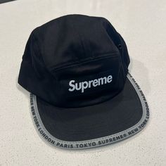 Nwt Supreme Black Worldwide Visor Tape Camp Hat Adjustable Black Baseball Cap For Winter, Black Sports Hat With Curved Brim, Black Travel Hat With Short Brim, Black Travel Hat With Curved Brim, Black Baseball Cap For Winter Sports, Black Short Brim Hat For Streetwear, Black Winter Sports Baseball Cap, Black Short Brim Travel Hat, Sporty Short Brim Hat For Streetwear