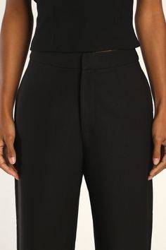 The Lulus Flair for the Fabulous Black Feather Straight Leg Pants are a fun twist on the classic dress pant silhouette! These lightweight woven pants boast a banded waist with a high-rise fit and a hidden top clasp with a hidden zip fly. Side seam pockets accent figure-skimming, straight pant legs before falling to feather-trimmed hems. Pair with the matching top for a complete look! Fit: This garment fits true to size. Length: Ankle length. Size medium Inseam: 27.75 Front Rise: 10.75 Waist: Fit Black Dress Pants With Elastic Waistband For Spring, Tailored Black Bottoms With Elastic Waistband, Classic Dress Pants For Night Out In Fall, Tailored Sleek Wide Leg Pants For Spring, Black Tailored Bottoms With Elastic Waistband, Formal Black Dress Pants With Elastic Waistband, Classic Black Pants With Elastic Waistband, Black Versatile Bottoms For Formal Occasions, Classic High-waisted Wide Leg Party Pants