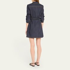 Cinq à Sept "Jenessa" indigo denim dress detailed with contrast topstitching and a D-ring belt Notched lapels; button closure Signature stylized sleeves Three-button cuffs Front flap patch pockets Mini length Cutaway hem A-line silhouette Cotton/polyester/elastane Dry clean Imported Chic Belted Denim Dress For Work, Elegant Collared Denim Dress For Work, Elegant Denim Dress With Button Closure For Work, Chic Button-up Denim Dress For Work, Knee-length Belted Denim Dress For Work, Collared Denim Dress With Button Closure For Work, Dark Wash Denim Dress For Work With Button Closure, Dark Wash Denim Dress With Button Closure For Work, Chic Denim Blue Shirt Dress For Work