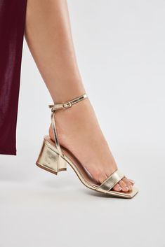 Available In Silver And Gold. Heeled Sandals Square Toe 2.25" Mid Heel Block Heel Imported | Jaylynn Heeled Sandals in Gold size 6 by Fashion Nova Gold Low Heel Summer Heels, Gold Ankle Strap Heels With Buckle Closure, Gold Block Heels With Buckle Closure For Summer, Gold Sandals With Block Heel, Gold Open Toe Block Heels With Padded Heel, Gold Block Heels With Buckle Closure For Spring, Gold Block Heel Heels With Buckle Closure, Gold Block Heel Shoes With Buckle Closure, Gold Block Heel With Buckle Closure