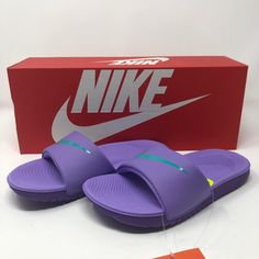 The Kids' Nike Kawa (Gs) Slide Features A Soft Synthetic Strap That Conforms To The Natural Movement Of Your Foot. Its Cushioned Platform Combines Plush Foam Underfoot With A Durable, Lightweight Outsole Foam For Long-Lasting Wear. Shaft Measures Approximately Low-Top From Arch Kids Sandals: Upgrade Your Sandals To These Nike Slide Sandals, Offering Both Style And Comfort For Everyday Wear In A Range Of Colors And Sizes. Synthetic Sandal Strap: Nike Slides Have A Soft Synthetic Strap That Confor Purple Synthetic Slides With Round Toe, Purple Synthetic Slides For Summer, Purple Slip-on Slides For The Beach, Purple Slip-on Slides For Beach, Purple Slip-on Slides For Summer, Purple Slip-on Beach Slides, Purple Cushioned Slip-on Sandals, Casual Purple Flat Sandals, Casual Purple Slip-on Slides