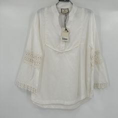 Tuckernuck | Tnuck Beach Piper Lace Top Color: Blanc Size: Medium Retail: $128 Condition: New With Tags 22.5" Pit-To-Pit 27" Long -Band Collar -V-Neckline -Long Sleeves -Eyelet Detailing On Elbows -Lace Detailing On Bib -Loose Fit -90% Cotton, 10% Linen -Machine Wash Cold. Gentle Cycle. Wash Separately. Do Not Bleach. Line Dry. Warm Iron. White Summer Beach Blouse, White Linen Top For Beach Season, White Summer Blouse For Beach Season, White Cotton Blouse For Beach Season, White Linen Top For Vacation, Casual Beach Season Blouse For Brunch, Casual Blouse For Beach Season Brunch, Casual Blouse For Brunch During Beach Season, White Summer Linen Blouse