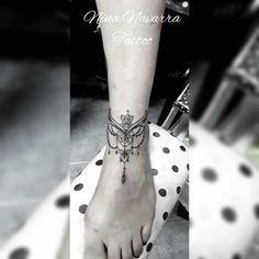 a woman's foot with a tattoo on her left ankle and the words, ma navara tatoo