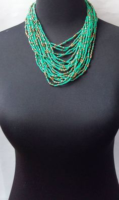 African beaded necklace made with the finest beads. Its a perfect accessory that will match most of your outfits. Suitable for any season. A good gift to your friends and loved ones. All our items are shipped through DHL Express. Delivered between 3 to 5 days. Multi-strand Turquoise Necklace With Colorful Beads For Gifts, Turquoise Beaded Necklaces With Spacer Beads, Turquoise Beaded Necklace With Spacer Beads, Green Turquoise Beaded Necklace As Gift, Elegant Multi-strand Turquoise Necklace Gift, Elegant Green Beaded Necklace With Large Beads, Turquoise Multi-strand Beaded Necklaces As Gift, Turquoise Multi-strand Beaded Necklace As Gift, Elegant Multi-strand Turquoise Beaded Necklaces