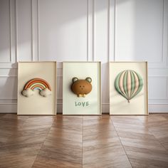 three framed pictures with animals and hot air balloons on the wall next to each other