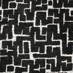 a black and white area rug with an abstract design