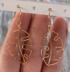 Monstera leaf design on 14k gold fill hooks/wire. Great for sensitive skin, and completely waterproof. Gold Leaf-shaped Nickel-free Earrings, Minimalist Leaf-shaped Ear Wire Jewelry, Adjustable Hypoallergenic Gold Earrings, 14k Gold-filled Wrap Earrings With Ear Wire, Gold Leaf-shaped Hoop Earrings For Gift, Nickel-free Adjustable Leaf-shaped Jewelry, Nickel-free Adjustable Leaf Jewelry, Adjustable Nickel-free Leaf-shaped Jewelry, Minimalist Gold Leaf Earrings