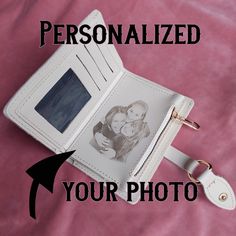 a personalized photo is placed in an open white wallet with a keychain