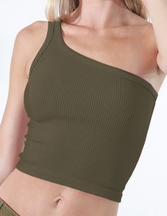 Size: One Size, fits anyone from a 32A-36DD. Description: A ribbed knit crop top featuring a one shoulder design and vintage wash. Fabric: 92% Nylon / 8% Spandex Made in USA Does not have padding, wiring or cups. We believe in highlighting the natural shape of a woman's body. Trendy Ribbed One Shoulder Top, Ribbed One-shoulder Top For Spring, Trendy Stretch Seamless One Shoulder Top, One Shoulder Ribbed Top For Spring, Spring Ribbed One-shoulder Top, One-shoulder Stretch Crop Top, Solid One Shoulder High Stretch Tops, Spring One-shoulder Ribbed Top, Casual Fitted Cropped One Shoulder Top