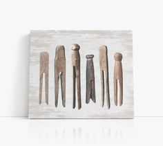 a group of wooden pegs sitting on top of a white table next to each other