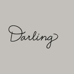 the word daring written in cursive writing on a gray background with black ink