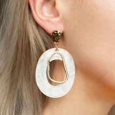 This beautiful & unique earring is a perfect gift for yourself or someone special.  Could be very pretty for the modern bride as well.  Details: Geometric Metal Color: Gold Material:  60% Resin, 40% Alloy Color: White Type: Dangle We are a small women's owned business and we appreciate your support!  ALL SALES ARE FINAL. NO REFUNDS OR RETURNS. Hypoallergenic White Metal Earrings, White Clip-on Drop Earrings, White Metal Drop Plug Earrings, Jewelry Formal, Neutral Earrings, Gem Drop Earrings, Unique Earring, Anthropologie Jewelry Earrings, Formal Jewelry