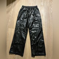 Super On Trend, Breathable And Good Quality. Adjustable Drawstring Waistband. Size Large. Never Worn Due To Sizing. Black Faux Leather Bottoms With Elastic Waistband, Faux Leather Pants, Pants Color, Drawstring Waistband, Cider, Drawstring Waist, Good Quality, Pant Jumpsuit, Leather Pants